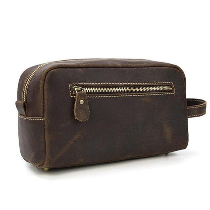 Dark brown genuine leather toiletry bag with front zip pocket and loop handle