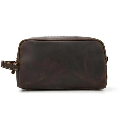 Brown genuine leather toiletry bag with rounded top, zip closure, side loop handle