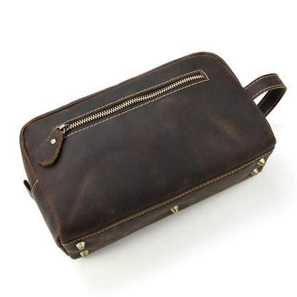 Dark brown genuine leather toiletry bag with front zip pocket and riveted bottom