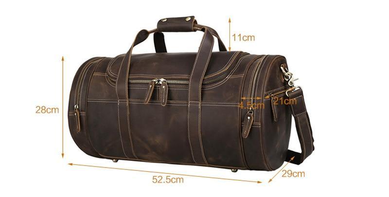 Brown leather round duffle bag with top handle, shoulder strap, and front zipper pockets.