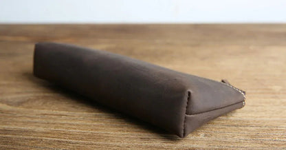 Brown leather pencil case end view with stitched seam and tapered profile