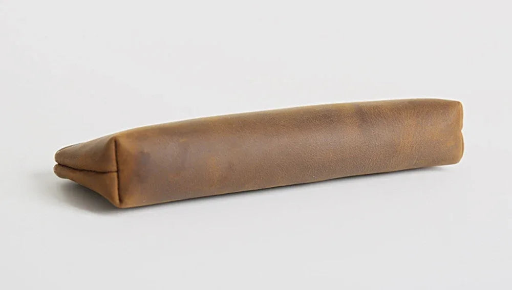 Brown leather pencil case side profile with smooth panel and stitched top edge