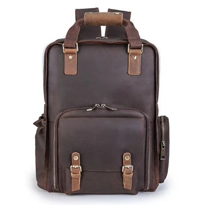 Dark brown leather camera backpack front view with dual zip pockets