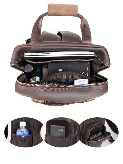 Dark brown leather camera backpack open showing internal organizers and side zip