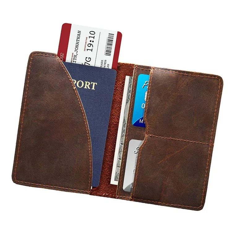 Brown leather passport cover open, with passport and ticket-style cards inside.
