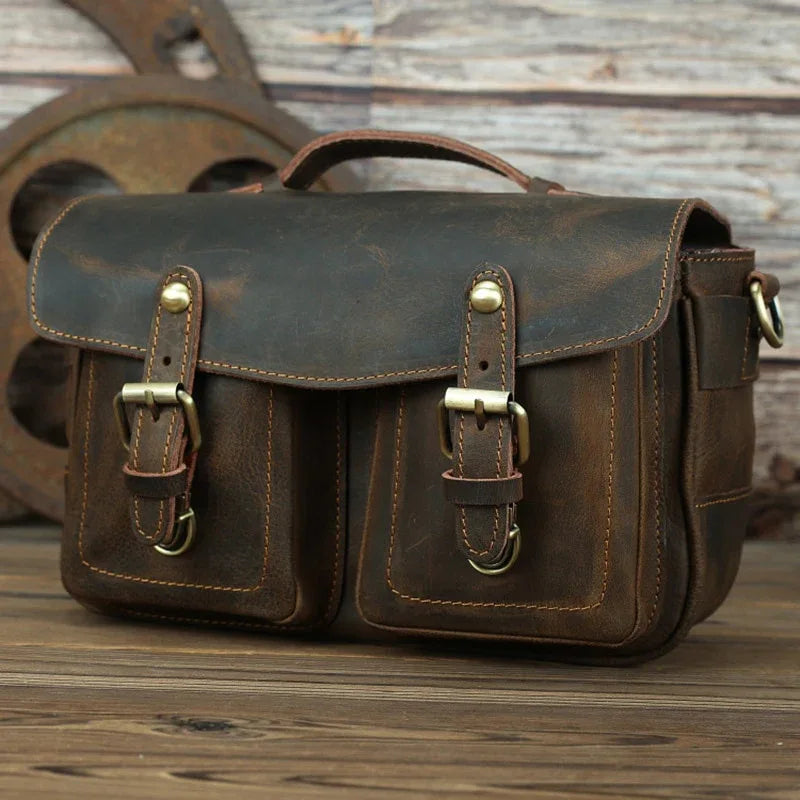 Dark brown leather camera messenger bag with front flap and buckle pockets