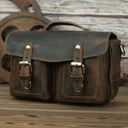 Dark brown leather camera messenger bag with front flap and buckle pockets