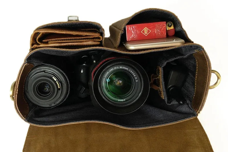 Vintage camera messenger bag, open top with two camera lenses inside