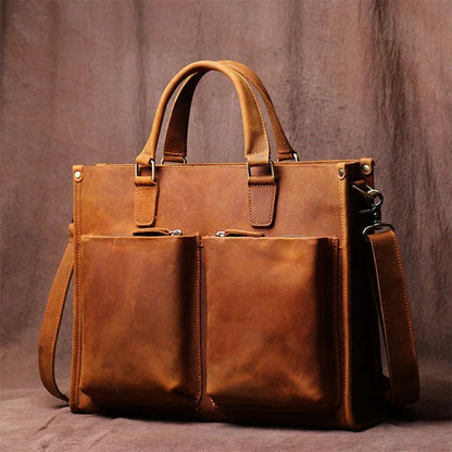 Brown leather messenger bag with dual front pockets and side strap; zipper closure