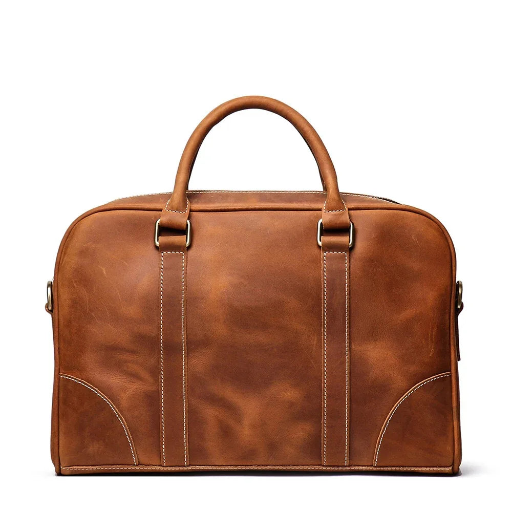 Vintage leather briefcase with two front strap details and metal buckles