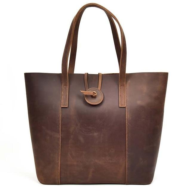 Leather tote bag with two top handles and front buckle clasp