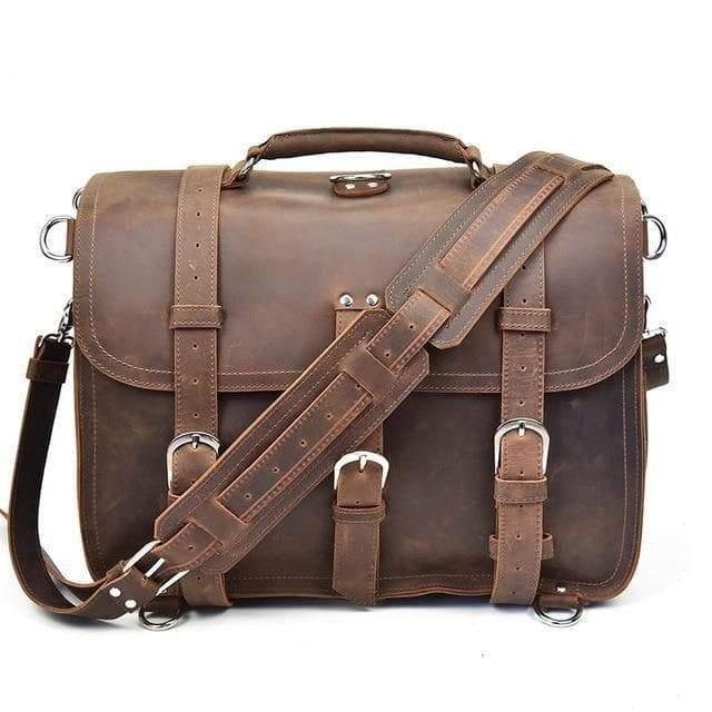 Dark brown vintage leather messenger bag with flap, buckles, and adjustable crossbody strap