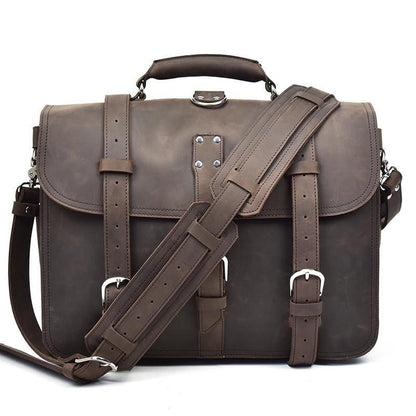 Dark brown leather messenger bag with crossbody strap, flap closure, and front buckle