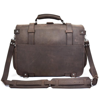 Dark brown leather messenger bag with front flap, buckled straps, and long crossbody strap