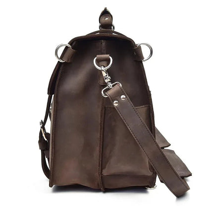 Dark brown leather messenger bag side with keyring D-rings and long crossbody strap