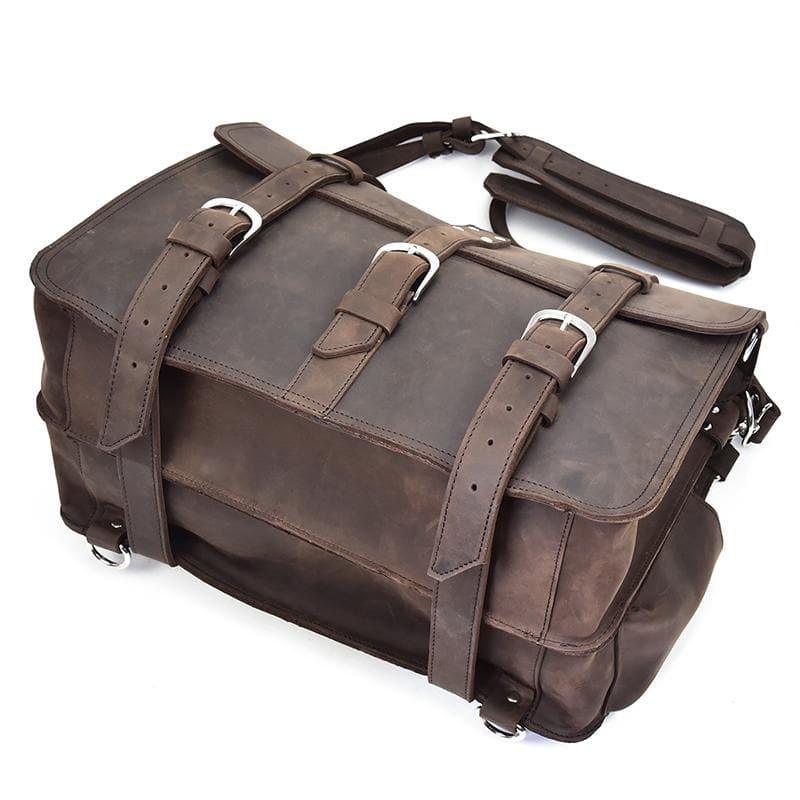 Dark brown leather messenger bag top view with multiple adjustable strap buckles