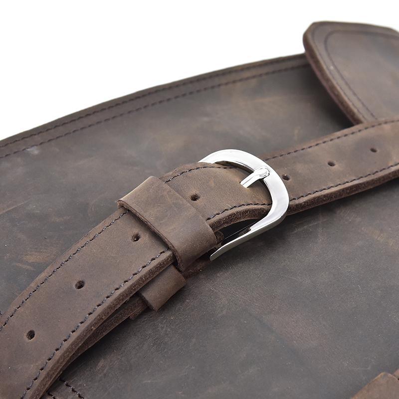 Dark brown leather messenger bag strap with adjustable buckle and metal loops
