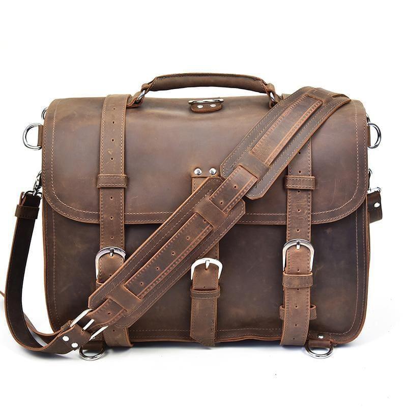 Dark brown leather messenger bag with crossbody strap and front buckle hardware