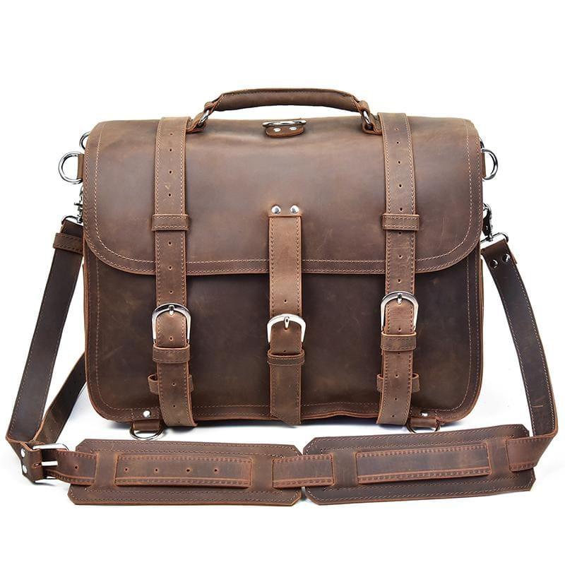Dark brown leather messenger bag with front flap, buckle details, and two straps