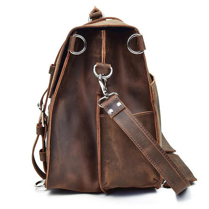 Brown leather messenger bag with side crossbody strap and metal key clasp on front.