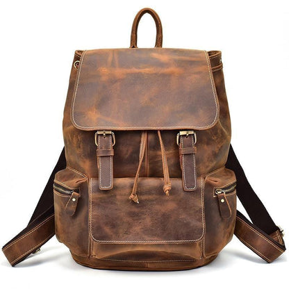 Brown vintage leather backpack with front flap, two side pockets, and adjustable straps.