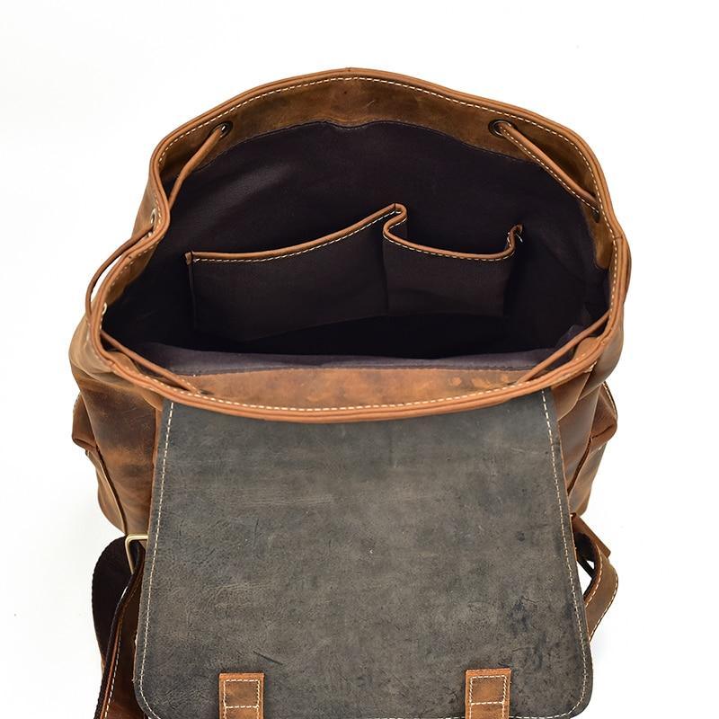 Vintage leather backpack interior with gray lining pocket, brown leather exterior