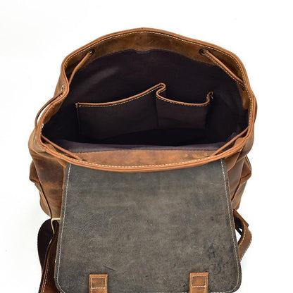 Vintage leather backpack interior with gray lining pocket, brown leather exterior