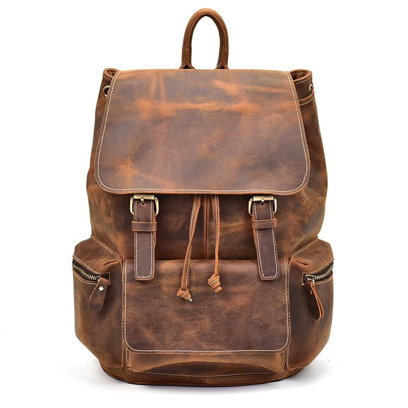 Brown vintage leather backpack with top flap, front buckles, and drawstring cords.