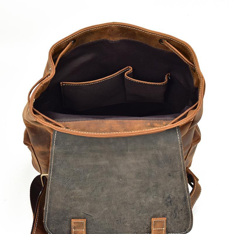 Leather backpack open top with gray front panel and inner storage pocket