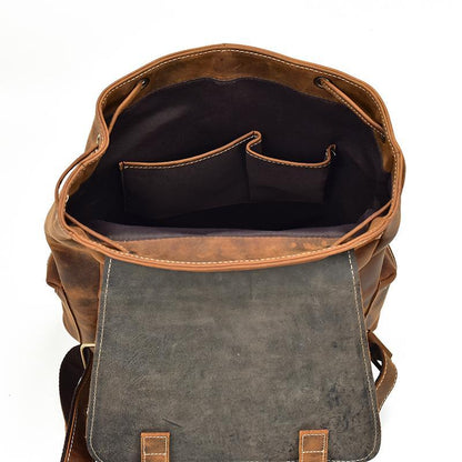 Leather backpack open top with gray front panel and inner storage pocket