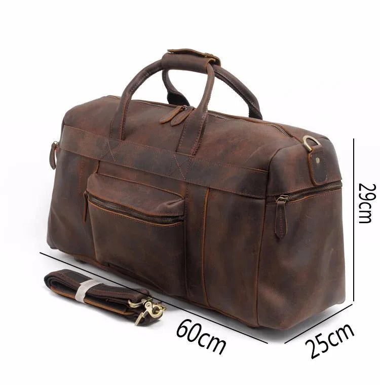 Brown leather duffle bag with top handle and front pockets, shown with dimensions