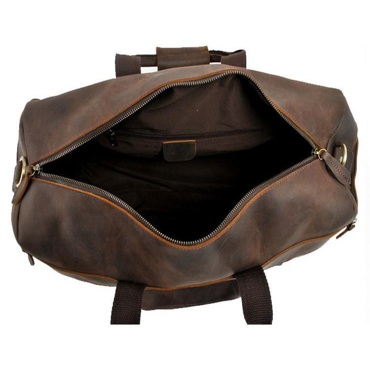 Brown leather duffle bag open top with brass zipper and inner organizer pocket