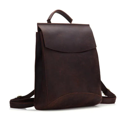 Dark brown leather backpack with front flap and adjustable shoulder straps
