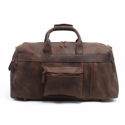 Brown leather duffle bag with top handle, front zip pocket, and dual side panels