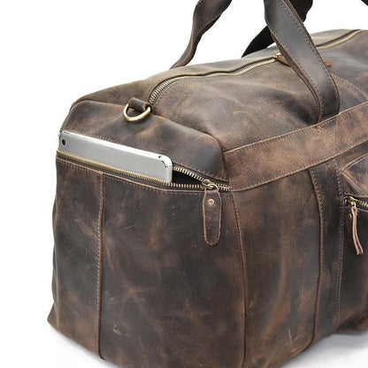 Distressed dark brown leather duffle bag side zipper pocket with metal D-ring handle