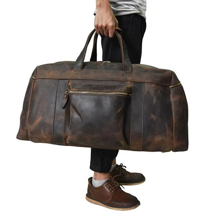 Distressed dark brown leather large duffle bag with top handles and zipper front pocket