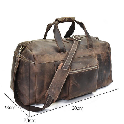 Brown leather duffle weekender with dimensions shown: 60cm length, 28cm depth.