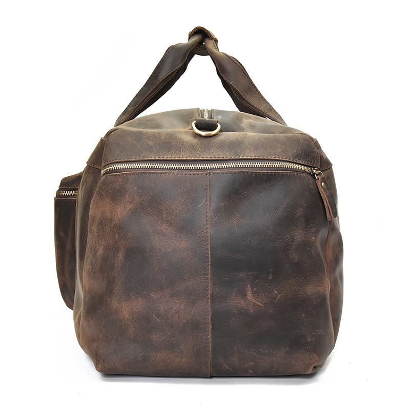 Distressed dark brown leather duffle bag with side handles and front zip pocket