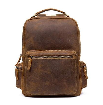 Brown leather vintage backpack front view with zipper pocket and side strap tabs