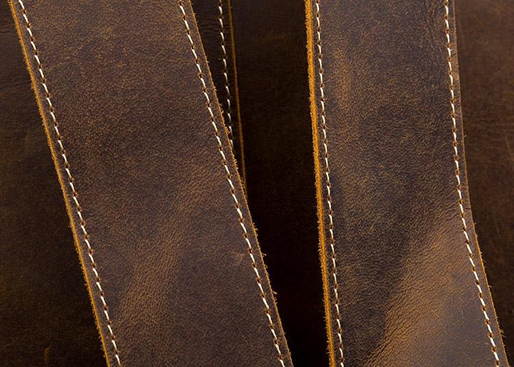 Brown leather vintage backpack close-up of vertical panel stitching details