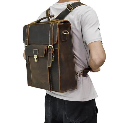 Brown leather backpack worn on shoulder with front flap, side straps, and pocket detailing