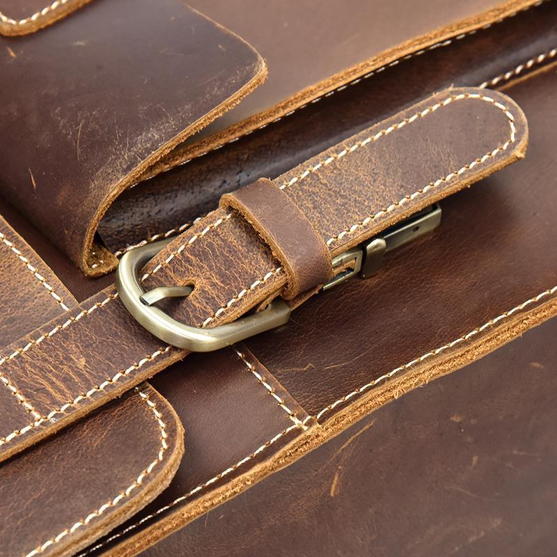 Leather backpack buckle strap with brass hardware and reinforced stitching