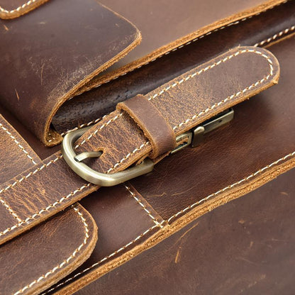 Leather backpack buckle strap with brass hardware and reinforced stitching