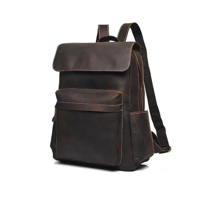 Vintage leather laptop backpack in dark brown, side view with adjustable shoulder strap.
