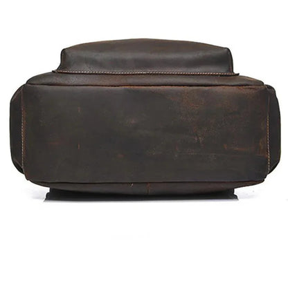 Vintage leather laptop backpack, rear view with padded top handle.