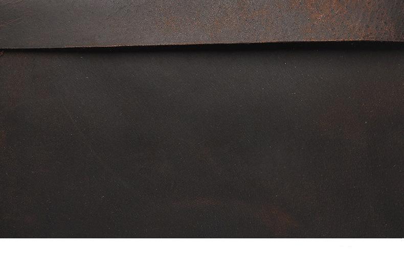 Dark brown leather texture on vintage laptop backpack surface.