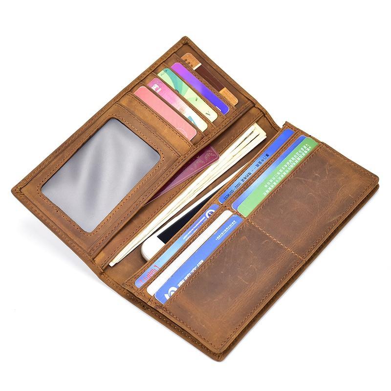 Brown leather pocket book filled with cards showing clear ID window and slots