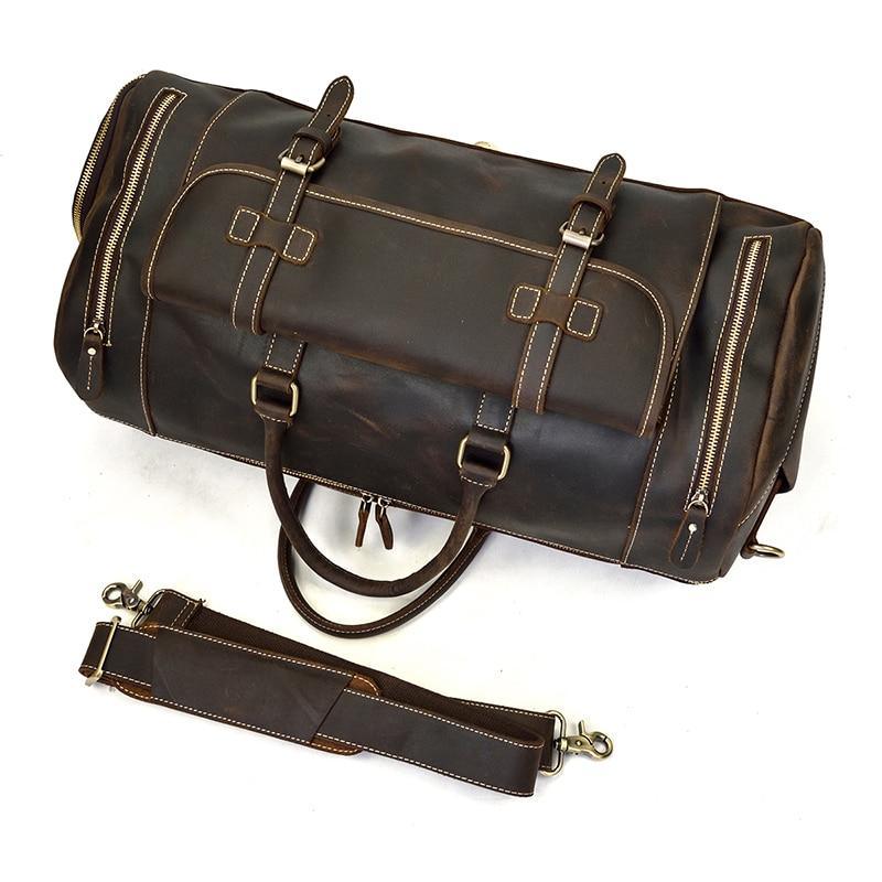 Handmade leather duffle bag in dark brown with detachable long strap, dual side zips, buckles