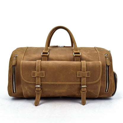 Handmade leather duffle bag in brown, top handles, front buckle strap, side zipper pockets