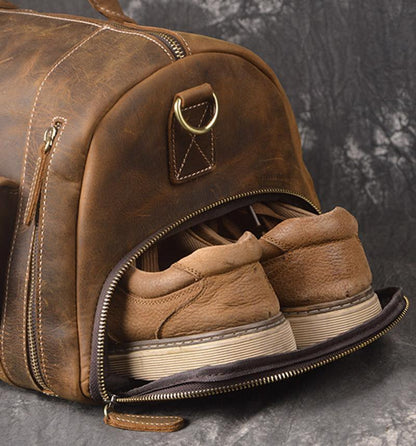Leather duffle bag open end showing interior shoe storage and zipper opening